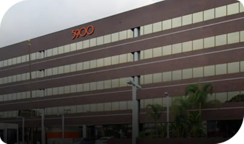 Multi-story professional office building at address 5900 housing Michael Burgis & Associates California workers' compensation and personal injury law firm