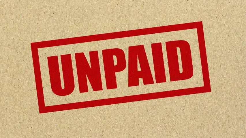 Red UNPAID stamp on textured paper symbolizing unpaid overtime and wage violations addressed by employment law attorneys in Sherman Oaks California